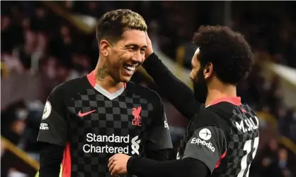  ??  ?? Roberto Firmino celebrates with Mohamed Salah after scoring in Liverpool’s win at Burnley on Wednesday. Liverpool are at home to Crystal Palace on Sunday. Photograph: Andrew Powell/Liverpool FC/Getty Images