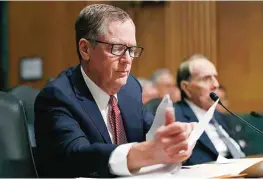  ?? —AP ?? WASHINGTON: In this March 14, 2017 file photo, United States Trade Representa­tive-nominee Robert Lighthizer (foreground) looks at documents during his confirmati­on hearing on Capitol Hill in Washington.