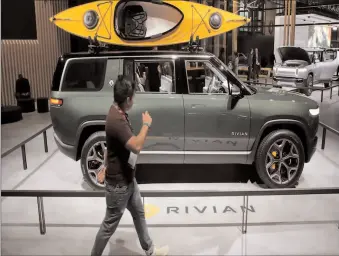  ?? -REUTERS ?? Rivian raised $1.3 billion from investors led by T Rowe Price, taking its total raised last year to $2.85bn.