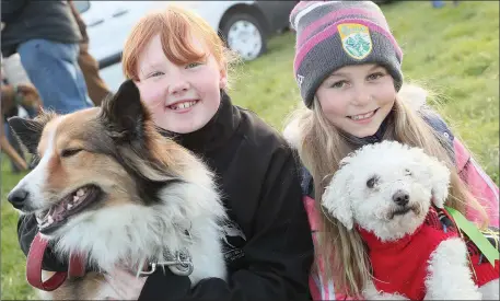  ??  ?? Blathnaid Brennan and Farrah Stack entered their dogs Foxy and Daisy in the dog show during the Point to Point races in Dowth.