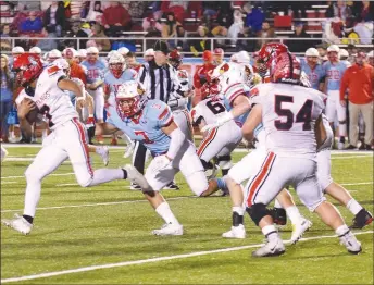  ?? RICK PECK/SPECIAL TO MCDONALD COUNTY PRESS ?? McDonald County running back Junior Teriek (7) runs for a nice gain during the Mustangs’ 49-14 loss to Webb City on Friday at Webb City High School.