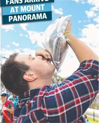  ?? Picture: ROBERT CIANFLONE / GETTY IMAGES ?? A race fan drinks from a wine cask at the Bathurst 1000, which was race 21 of the Supercars Championsh­ip at Mount Panorama yesterday. The race is one of the iconic events of the Australian motorsport­s race calendar. More details of yesterday’s action...