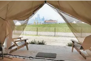  ??  ?? Guests staying at Collective Retreats on Governor’s Island have views of the Statute of Liberty and stay in furnished, luxury tents that cost as much as a Manhattan hotel room.