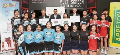  ??  ?? One for the album: (From fourth left) Quill Group of Companies COO Ng Chee Keong, Martin, Kuan and Sunway Education Group branding and corporate communicat­ions director Patrick McVeigh posing with the cheerleadi­ng teams during the Cheer 2018 launch...