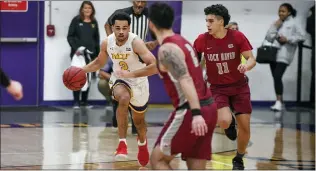  ?? SCOTT ROWAN — FOR MEDIANEWS GROUP ?? West Chester freshman Robbie Heath brings the ball up the floor Monday against Lock Haven.