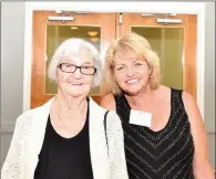  ??  ?? Joan Ryan, left, and her daughter Kathleen Cherry serve as volunteers at the first Jacksonvil­le Citizen of the Year Awards.
