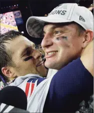  ?? Kathy Willens / Associated Press ?? Patriots quarterbac­k Tom Brady, left, and Rob Gronkowski celebrate after they defeated the Seahawks in Super Bowl XLIX in 2015. Gronkowski is one of 218 players to appear in a Super Bowl as Brady’s teammate, a number that will grow by more than 40 this week.