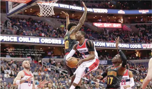  ?? — USA Today Sports ?? Washington Wizards’ John Wall (2) is fouled while shooting by Atlanta Hawks’ John Collins at Capital One Arena.