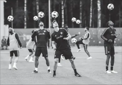  ?? Photo: VCG ?? Belgian players take part in a training session on Monday in Moscow, ahead of their World Cup semifinal match against France on Tuesday in Saint Petersburg, Russia.