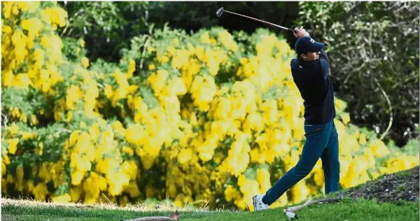  ??  ?? Good start: Jordan Spieth hits from the 13th hole fairway during the first round of the Genesis Open at Riviera Country Club on Thursday.