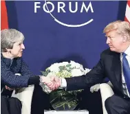  ?? FILE ?? US President Donald Trump meets British Prime Minister Theresa May at the World Economic Forum in Davos, Switzerlan­d, earlier this year.