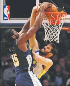  ?? Jack Dempsey, The Associated Press ?? Nuggets forward Kenneth Faried dunks against Warriors forward Omri Casspi in Saturday night’s game.