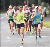  ?? Brian Pounds / Hearst Connecticu­t Media ?? Runners compete in the Faxon Law New Haven Road Race in 2019.