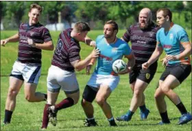  ?? DEBBY HIGH/FOR DIGITAL FIRST MEDIA ?? North Penn’s Scrum Rags surround a Harrisburg player at Saturday’s North Penn Rugby Club’s Annual 7’s Tournament.