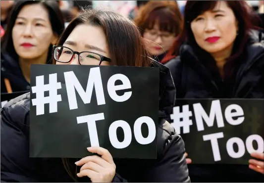  ?? Photo: AFP ?? South Korean demonstrat­ors hold signs during a rally to mark Internatio­nal Women’s Day as part of the country’s #MeToo movement, in Seoul on Thursday. The #MeToo movement has gradually gained ground in South Korea, which remains socially conservati­ve...