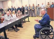  ?? NATHAN LAMBRECHT/THE MONITOR ?? Gov. Greg Abbott, right, talks with Secretary of Homeland Security John Kelly, left, before a briefing on border security Wednesday in Weslaco, Texas.