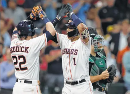  ?? Karen Warren / Houston Chronicle ?? Carlos Correa, right, celebrates the first of his two two-run homers with Astros teammate Josh Reddick during the fourth inning Thursday at Minute Maid Park. Reddick also had a good day at the plate despite being robbed of a hit in the first.