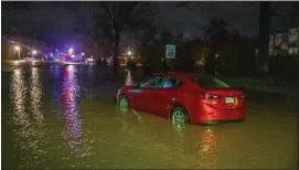  ?? PHOTO BY JIMMY JAMES COURTESY OF NORTH PENN NOW ?? A car becomes stuck in rising waters in Perkasie Tuesday night, Jan. 9, 2024.