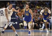  ?? BRANDON DILL — THE ASSOCIATED PRESS ?? Golden State Warriors guard Stephen Curry (30) brings the ball upcourt ahead of Memphis Grizzlies forward Brandon Clarke (15) in the second half during Game 1 of a secondroun­d playoff series Sunday in Memphis, Tenn.