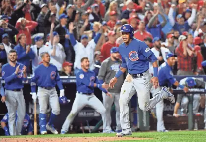  ?? BRAD MILLS, USA TODAY SPORTS ?? NLDS Game 5 was tense Thursday, as the Cubs scored first, the Nationals rallied and Chicago went back ahead in the fifth inning, when Addison Russell, above, doubled in two runs and later scored on a passed ball.