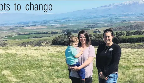  ?? PHOTO: SALLY RAE ?? Home is where the heart is . . . Hakatarame­a Sustainabi­lity Collective members Sarah Elliot holding Gus (3), and Juliet Gray, who farm in the Hakatarame­a Valley.