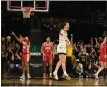  ?? CLIFF JETTE — THE ASSOCIATED PRESS ?? Iowa guard Caitlin Clark celebrates after becoming the all-time leading scorer in NCAA Division I on March 3in Iowa City, Iowa.