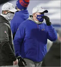  ?? CHARLIE RIEDELAND ADRIAN KRAUS — THE ASSOCIATED PRESS ?? Chiefs head coach Andy Reid, second from left, fired Bills head coach Sean McDermott, far right, as his defensive coordinato­r with the Eagles, but there’s admiration in their relationsh­ip, not bitterness.