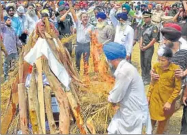  ?? AFP ?? Slain soldier Paramjit Singh’s family performs his last rites in Punjab’s Vain Poin village on Tuesday.