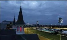  ?? DARRON CUMMINGS — THE ASSOCIATED PRESS ?? Horses train on the track before the 144th running of the Kentucky Oaks horse race at Churchill Downs Friday in Louisville, Ky. The 144th Kentucky Derby is Saturday.