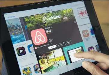  ?? John MacDougall AFP/Getty Images ?? CORRESPOND­ENCE from an associatio­n’s management company appears prompted by some homeowners who are renting out their units on the Airbnb platform. Above, the short-term rental company’s website.