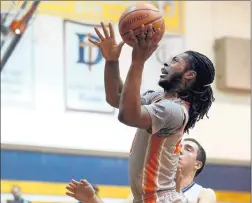  ?? KEVIN TANAKA/DAILY SOUTHTOWN ?? Leo’s DaChaun Anderson drives to the basket against DePaul Prep on Friday. Anderson had 16 points and 14 rebounds.