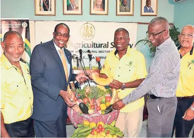  ?? CONTRIBUTE­D ?? From left: Donald Berry, first vice-president, Jamaica Agricultur­al Society (JAS); Steven Wedderburn, chief technical director, MICAF; Senator Norman Grant, JAS president; Christophe­r Emanuel, chief executive officer; and Delroy Redway, St Ann parish...