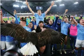  ?? ?? Lazio players celebrate after their win in the Rome derby. Photograph: Federico Proietti/ DPPI/Shuttersto­ck