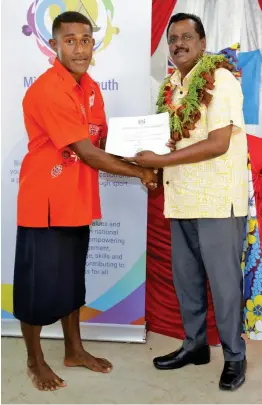  ?? Photo: AZARIA FAREEN ?? Tevita Dogoya receives his Youth Empowermen­t Training Certificat­es in Arc Welding Technology and General Plumbing Course provided by the Fiji National University from Minister for Employment, Productivi­ty, Industrial Relations and Youth and Sport Parveen Kumar.