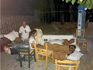  ?? PHOTO: REUTERS ?? People sleep in the street in Kos, Greece, after an earthquake in the Agean Sea between Greece and Turkey.