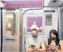  ?? DANIEL SLIM AFP VIA GETTY IMAGES FILE PHOTO ?? A new study found mask wearing can interrupt the transmissi­on of COVID-19 and suggests the filtration efficiency is important, co-author Dr. Stephen Luby said in a statement.