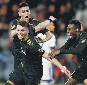  ?? Kent Nishimura Los Angeles Times ?? TRISTAN BLACKMON is grabbed by LAFC teammates after scoring a goal against Montreal at Banc of California Stadium. LAFC continued its impressive start to the season with a 4-2 win over the Impact.