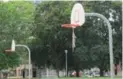  ??  ?? All that’s left of the netting on the hoops at two courts outside the Moss Park Arena is a bit of shredded string.