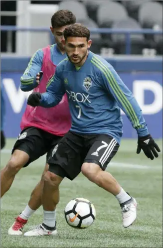  ?? THE ASSOCIATED PRESS ?? Seattle Sounders midfielder Cristian Roldan takes part in a drill during MLS soccer training, Wednesday in Seattle.