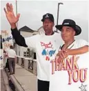  ?? RED HUBER/ORLANDO SENTINEL ?? Julius Erving, left, and Curly Neal, right, join Magic employees thanking Orlando fans for their support. Neal was an elite dribbler with the Harlem Globetrott­ers and played an integral role in bringing the NBA to Central Florida after his retirement.