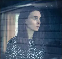 ??  ?? This image released by A24 shows Rooney Mara in a scene from the film “A Ghost Story.” Casey Affleck is shown in a scene from the film “A Ghost Story.”