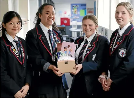  ?? PHOTOS: ANDY JACKSON/STUFF ?? Taranaki Diocesan students Isabel Lee, Maia Rupapera-Maeke, Rebecca Schrader and Alex Paish have created a period starter kit aimed at young girls and girls in poverty.