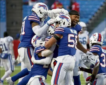  ?? Ap ?? Buffalo Bills players celebrate after beating the indianapol­is Colts in an NFL Wild Card playoff game on saturday in Orchard Park, n.y.