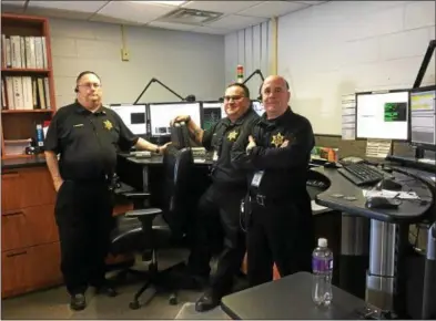  ?? PHOTOS BY MAUREEN WERTHER — FOR THE SARATOGIAN ?? From left, Jeffrey Reisner, who has 35 years on the job, with teammates Ben Cuttita and George Downs, taking a quick break for a photo before returning to their stations.