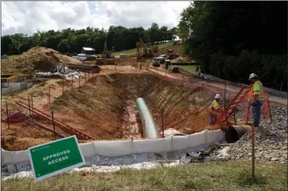  ?? The Associated Press ?? TUNNELING THROUGH: In this June 22, 2018, file photo, constructi­on crews are boring beneath U.S. 221 in Roanoke County, Va., to make a tunnel through which the Mountain Valley Pipeline will pass under the highway. The U.S. Army Corps of Engineers has suspended a nationwide program used to approve oil and gas pipelines, power lines and other utility work, spurred by a court ruling that industry representa­tives warn could slow or halt numerous projects over environmen­tal concerns.