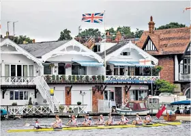  ??  ?? Idyllic: A crew make their way to the start line at the Henley Royal Regatta
