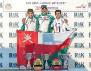  ??  ?? TALENTED DUO: Mohammed Al Habsi and Shihab Al Habsi celebrate with Omani motorsport legend Hamed Al Wahaibi.