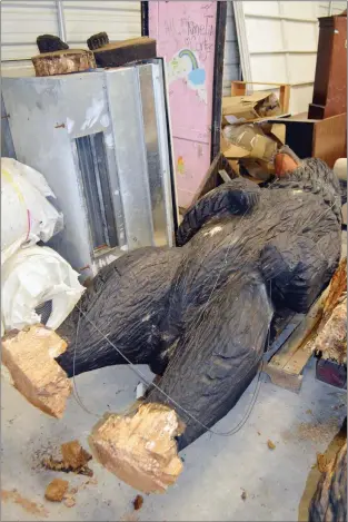  ?? TAMMY KEITH/RIVER VALLEY & OZARK EDITION ?? Valor the bear hibernates in a storage building at the University of Central Arkansas. Two of his paws, shown at left, were removed after being damaged by termites and water. His torso also has a crack. Larry Lawrence, director of the UCA Physical...