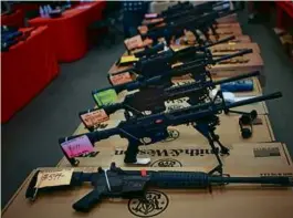  ?? LUKE SHARRETT/THE NEW YORK TIMES/2014 FILE ?? The Biden administra­tion decision to expand background checks moved to close the so-called gun show loophole.