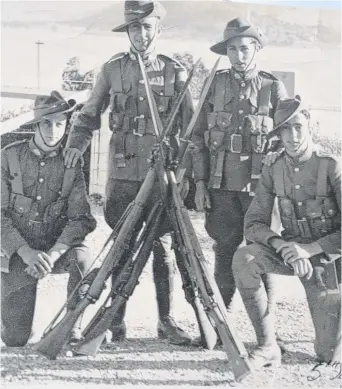  ??  ?? Rex Stoffell (far right) pictured with mates at his militia unit in September 1939.